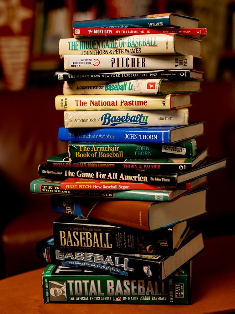 a stack of books about baseball
